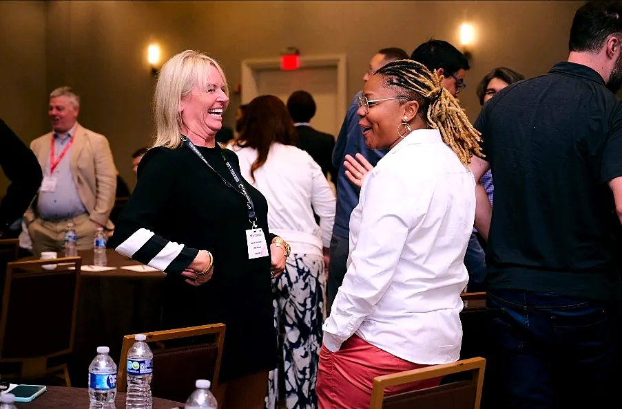 Attendees networking at a cybersecurity summit